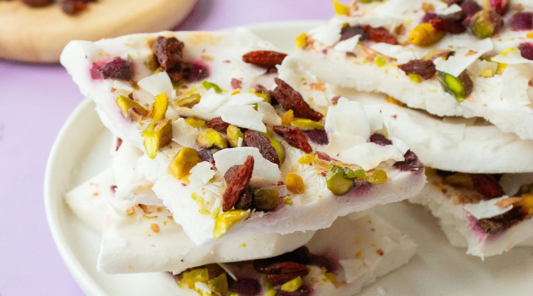 Plaque of frozen yogurt with acai, pistachio and cranberry